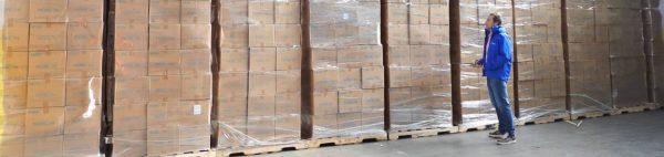Stone Management employee taking inventory in their 3PL warehouse.