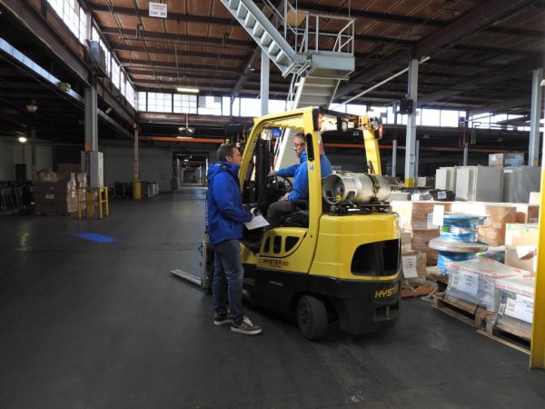 Stone Management employees discussing warehousing work.