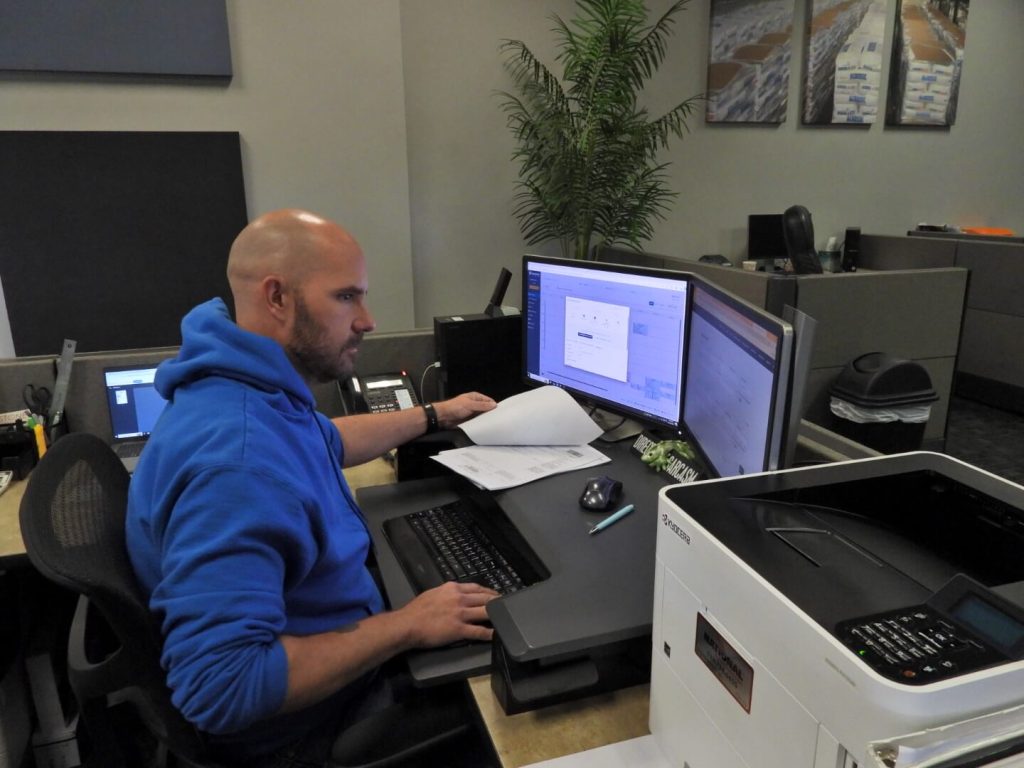 Stone Management employee working in his office.